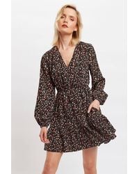 Louche - Giovanna Wax Flower Print Long Sleeved Tie Mini Dress - Lyst