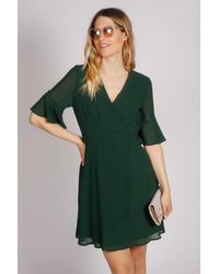 Tenki - Half Sleeve Plain Wrap Style Dress - Lyst