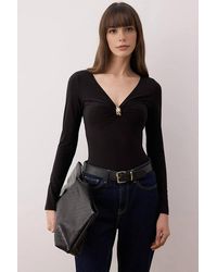 WOVCOR - V-Neck Fitted Knit Bodysuit W/ Ring Detail - Lyst