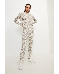 Karen Millen - Lounge Animal Print Slim Leg Jersey Trousers - Lyst
