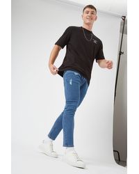 Burton - Skinny Crop Mid Blue Rip Jeans - Lyst