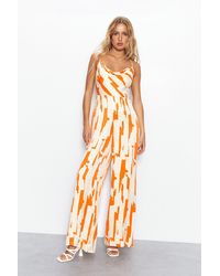 Warehouse - Abstract Print Satin Cowl Strappy Jumpsuit - Lyst