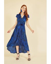Mela - Blue Animal Print Dip Hem Midi Wrap Dress - Lyst