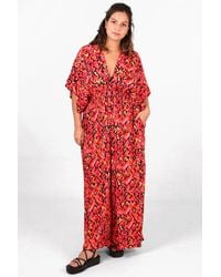 SARTA - Abstract Print Flared Wide Leg Shirred Jumpsuit With A Deep V Neck - Lyst