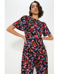 Oasis - Floral Printed Crepe Belted Jumpsuit - Lyst