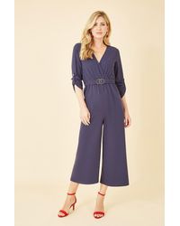 Mela - Wrap Over Stretch Jumpsuit With Gold Belt - Lyst