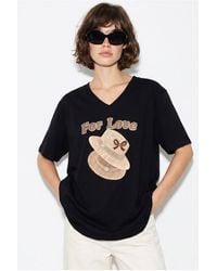 Bianco Lucci - Oversized V-Neck Printed T-Shirt - Lyst