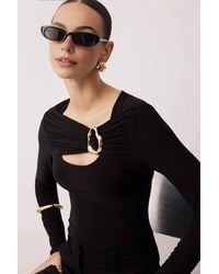 WOVCOR - Fitted Stretch Knit Blouse W/ Cut Out & Hardware Detail - Lyst