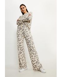 Karen Millen - Lounge Animal Print Wide Leg Jersey Trousers - Lyst