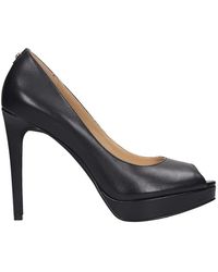 black leather pumps with ankle strap
