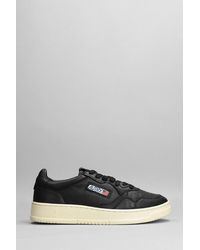 Autry Mid Sneakers In Black Leather for Men | Lyst