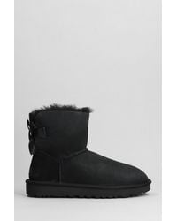 UGG - Mini Bailey Bow Ii Low Heels Ankle Boots In Black Suede - Lyst