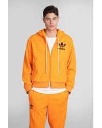 Originals trefoil logo adicolor tnt tape hoodie yellow hot sale