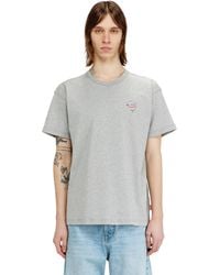 DIESEL - T-Shirt With Dolphin And Logo Print - Lyst