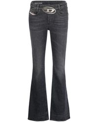 DIESEL - | Jeans in cotone bootcut con vita bassa e logo Oval D cut-out in metallo | female | NERO | 29 - Lyst