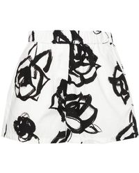 MSGM - | Shorts in cotone con stampa a fiori | female | BIANCO | 42 - Lyst