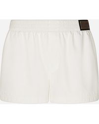 Dolce & Gabbana - Short swim trunks with branded tag - Lyst