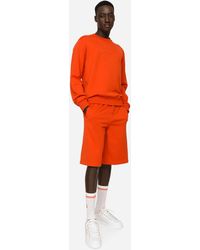 Dolce & Gabbana Sweatshirt Jersey mit geprägtem DG-Logo - Orange