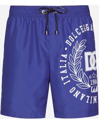Mid-length swim trunks with metal DG logo male 44 Dolce & Gabbana Uomo Sport & Swimwear Costumi da bagno Pantaloncini da bagno Beachwear 