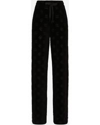 Dolce & Gabbana Flocked Jersey Trousers With All-over Dg Logo - Black