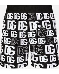 Dolce & Gabbana Shorts de punto bielástico con estampado de logotipos DG - Negro
