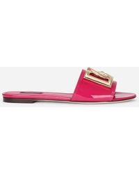 sandalias y chanclas de Chanclas de dedo y de pala Sandalias con logo Dolce & Gabbana de Caucho de color Rosa Mujer Zapatos de Zapatos planos 