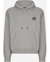 Dolce & Gabbana - Felpa jersey con cappuccio e placca logata - Lyst