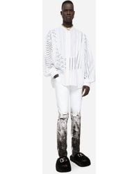 Dolce & Gabbana Jeans Skinny Stretch mit Rissen und Pinselstrichen - Weiß