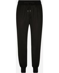 Dolce & Gabbana - Pantalón De Chándal En Punto Técnico Con Placa - Lyst