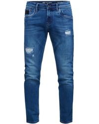 Rusty Neal - Jeansbroek "tori" Slim Fit Destroyed Denim - Lyst