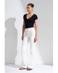 Dilvin - Mid-Waist Flare Jersey Pants With Drawstring - Lyst