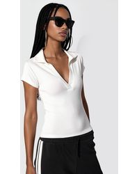Busem - Ribbed Slim-Fit Polo Blouse - Lyst