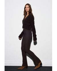 Dilvin - High-Waist Flare Leggings With Button Detail - Lyst