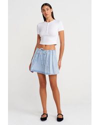 Dilvin - Cotton Denim Mini A-Line Skirt With Bow Detail - Lyst