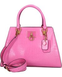 Guess - Bolsos ... Rosa - Lyst