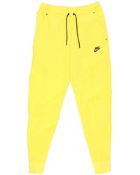 Nike - Lichtgewicht Trainingsbroek Sportkleding Tech Fleece Broek Geel Strike/Zwart - Lyst
