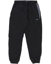 DOLLY NOIRE - Urban Trainingsbroek Baggy Zwart - Lyst
