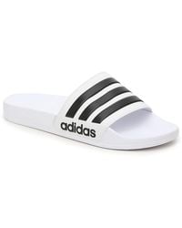 white adidas flip flops