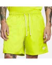 nike club essentials woven flow shorts yellow