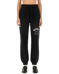 Moschino - Relaxed Fit Jogging Pants With Logo - Lyst