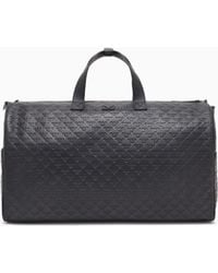 Emporio Armani - Leather Duffel Bag With All-Over Embossed Eagle - Lyst