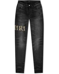 Amiri - Baroque Varsity Logo Jeans - Lyst