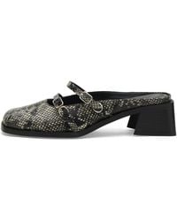 Justine Clenquet - Andie Python Mules - Lyst