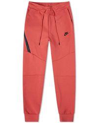 orange nike tech fleece joggers