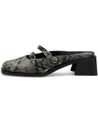 Justine Clenquet - Andie Python Mules - Lyst