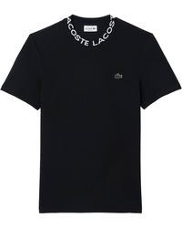 Lacoste - T-Shirt aus PIQUÉ mit Logo-Jacquard-Kragen Regular Fit - Lyst