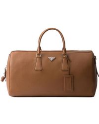 Prada - Textured Leather Duffle Bag - Lyst