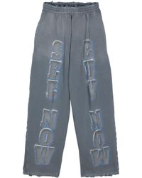 Balenciaga - Slogan-Print Cotton Track Pants - Lyst
