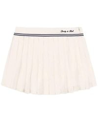 Sporty & Rich - Serif Pleated Logo-Embroidered Mini Skirt - Lyst