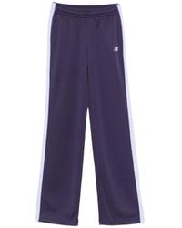 New Balance - Interlock Logo-Embroidered Track Pants - Lyst